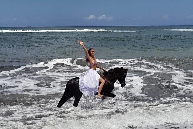 Bali Horse Riding Trot & Canter Saba Beach with Local Temple - Riding Saba Beach’s volcanic shoreline