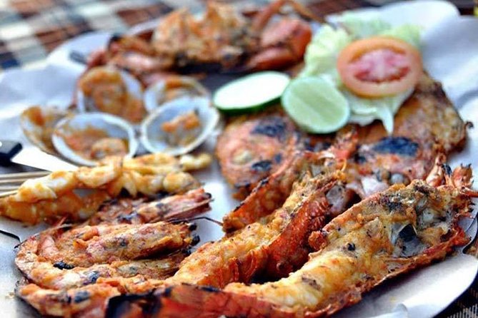 Best Romantic Seafood Dinner at Jimbaran Beach Sunset - A beach view with uneven service