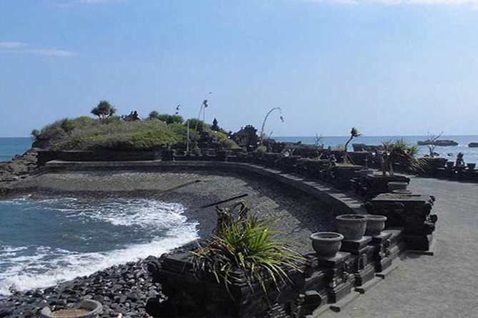 Half-Day Taman Ayun UNESCO and Tanah Lot Temple with private Car - Entering Taman Ayun through the bridge and gate