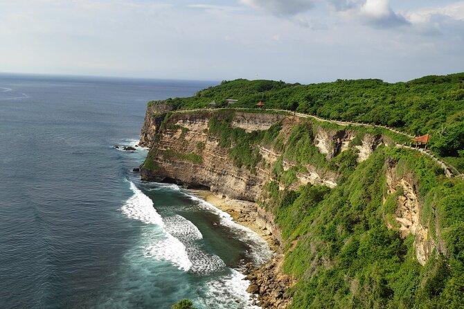 Uluwatu Cliff Temple sunset Tour with Kecak Show and Sea Food Dinner at Jimbaran Beach - Uluwatu at sunset, where the cliffs do the talking